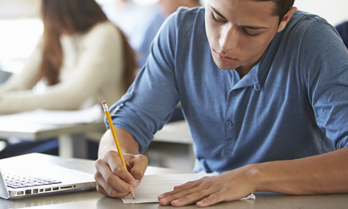 High School Students Taking Test In Classroom